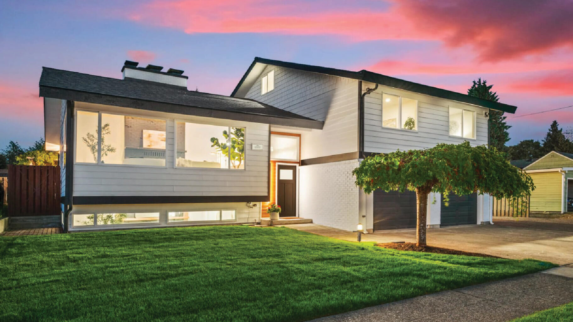 Modern custom home exterior at dusk in the Puget Sound area